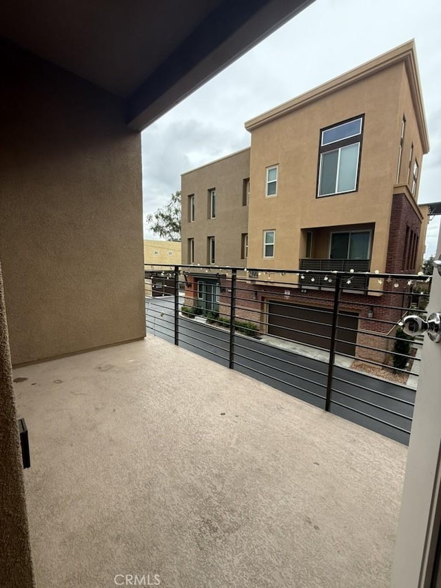 view of patio with a balcony