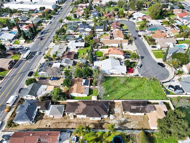 birds eye view of property with a residential view