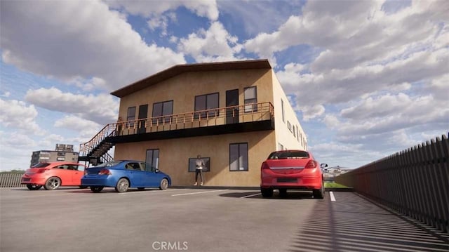 exterior space featuring stairs and fence