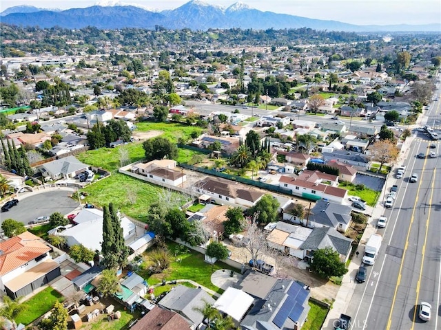 birds eye view of property with a residential view and a mountain view