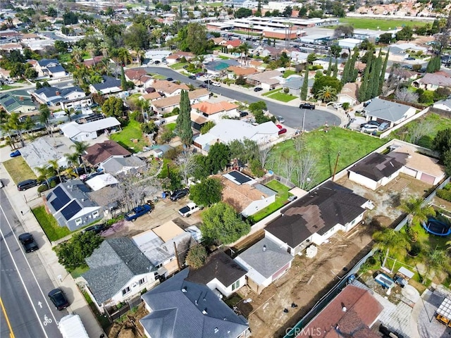 birds eye view of property with a residential view