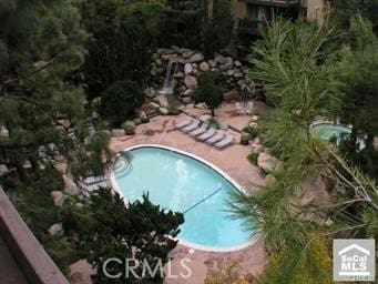 community pool featuring a patio