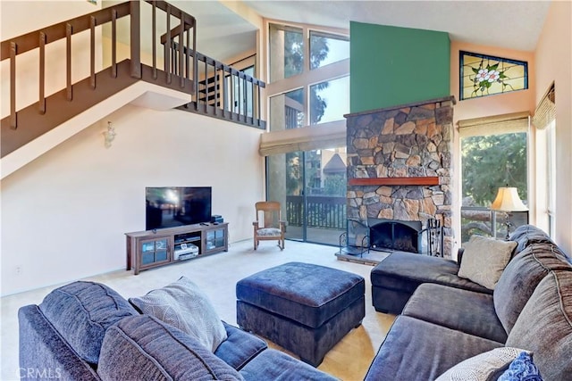 living area with high vaulted ceiling, carpet flooring, and a fireplace