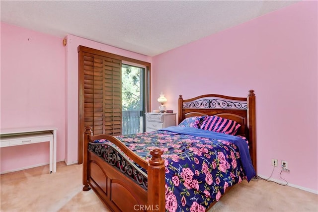 carpeted bedroom with a textured ceiling