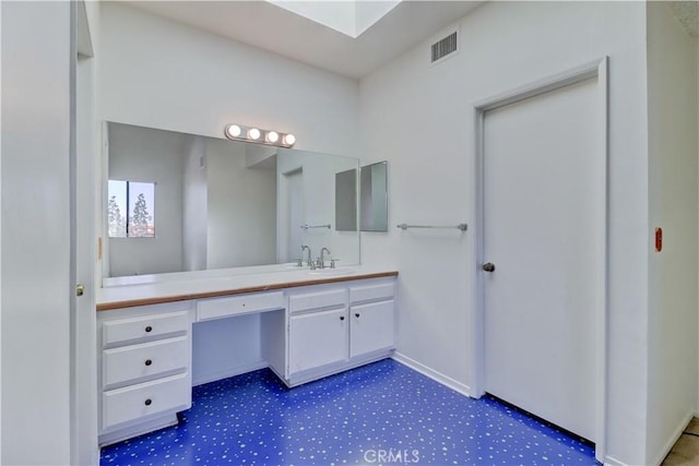 bathroom featuring visible vents and vanity