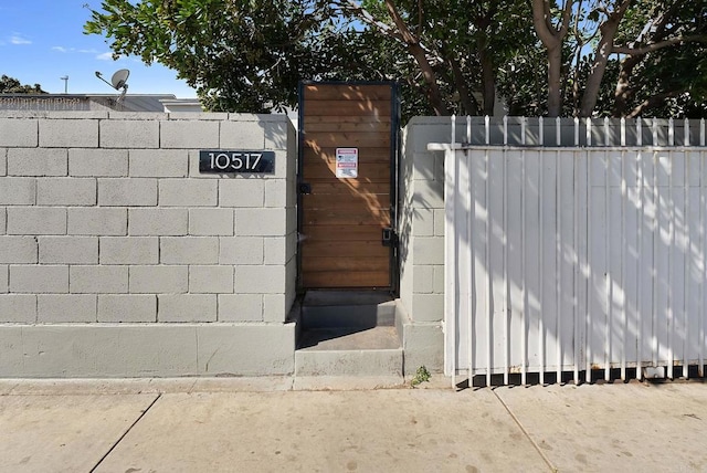 view of gate featuring fence