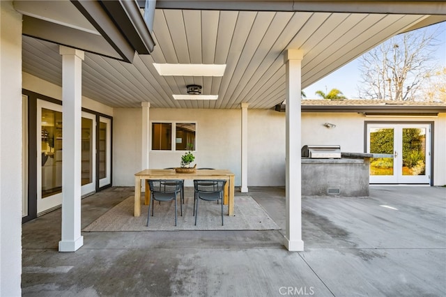 view of patio / terrace with outdoor dining area and exterior kitchen