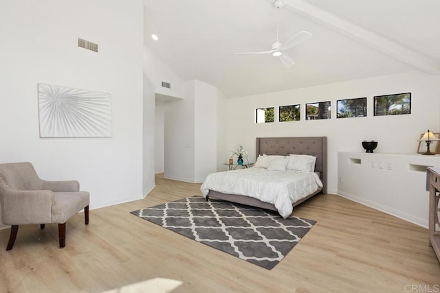 bedroom featuring high vaulted ceiling, light wood-style flooring, beamed ceiling, and visible vents