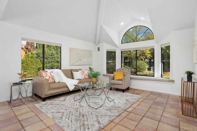 sunroom / solarium featuring vaulted ceiling and plenty of natural light