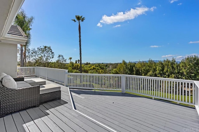 wooden deck with outdoor lounge area