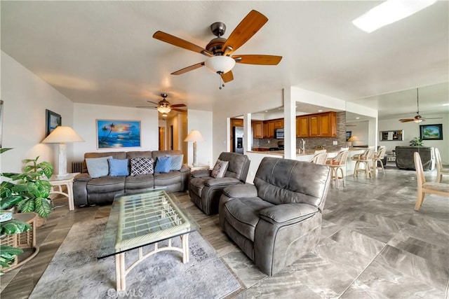 living area with ceiling fan