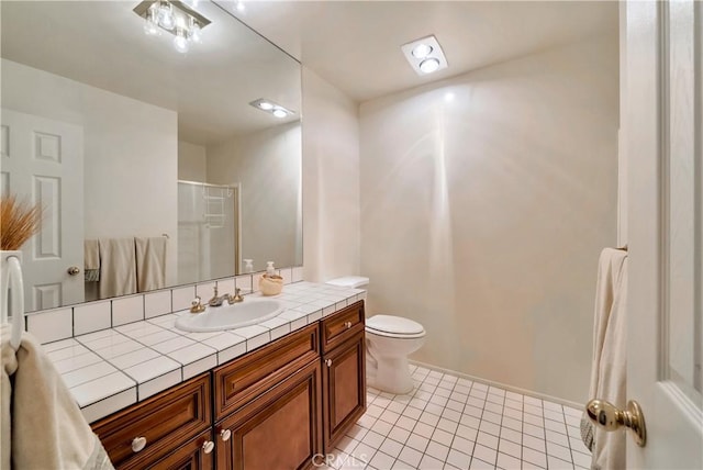 full bath with tile patterned flooring, toilet, a shower with shower door, and vanity