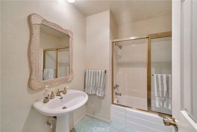 411 Avenida Granada Unit 2B, San Clemente, CA 92672 - bathroom featuring shower / bath combination with glass door and tile patterned floors