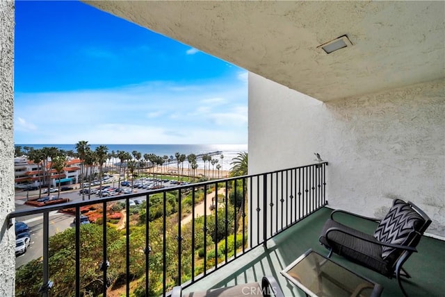 balcony featuring a water view