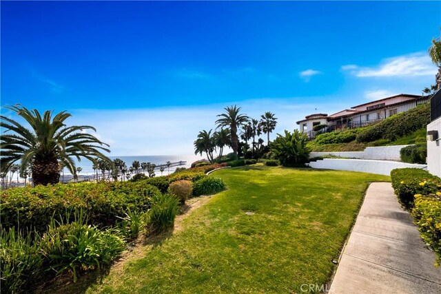 411 Avenida Granada Unit 2B, San Clemente, CA 92672 - view of property's community featuring a lawn and a water view