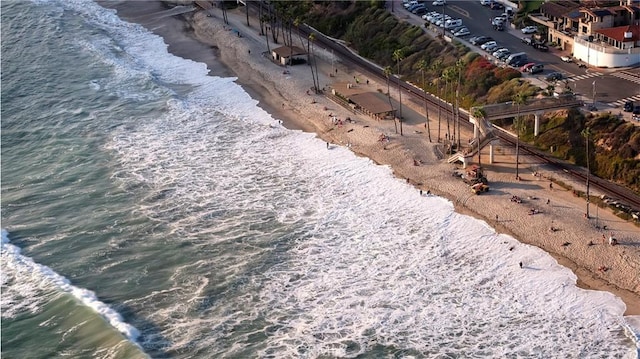 exterior space with a beach view and a water view