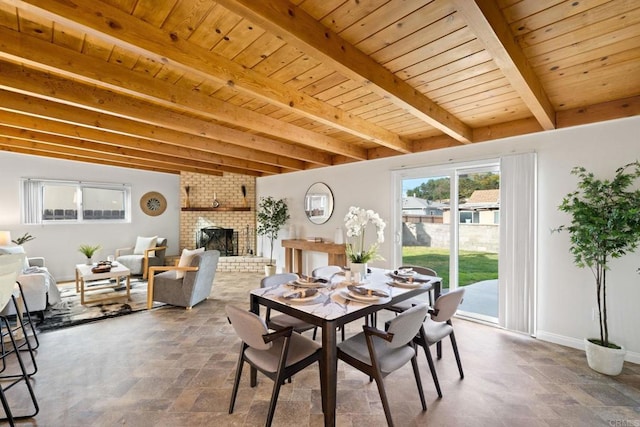 dining room with wood ceiling, stone finish floor, and beamed ceiling