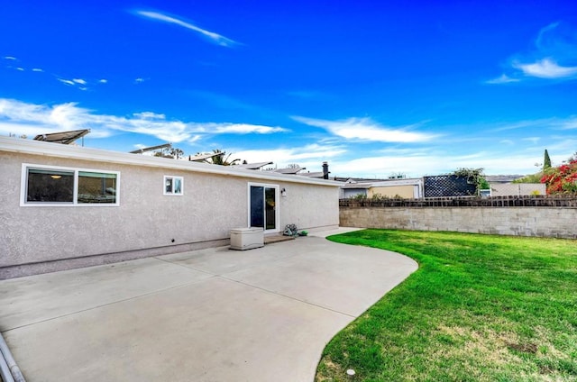 view of yard featuring fence and a patio