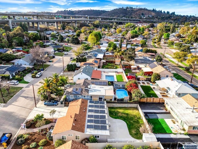 birds eye view of property featuring a mountain view