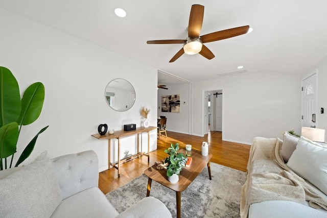 living room with lofted ceiling, ceiling fan, wood finished floors, and recessed lighting