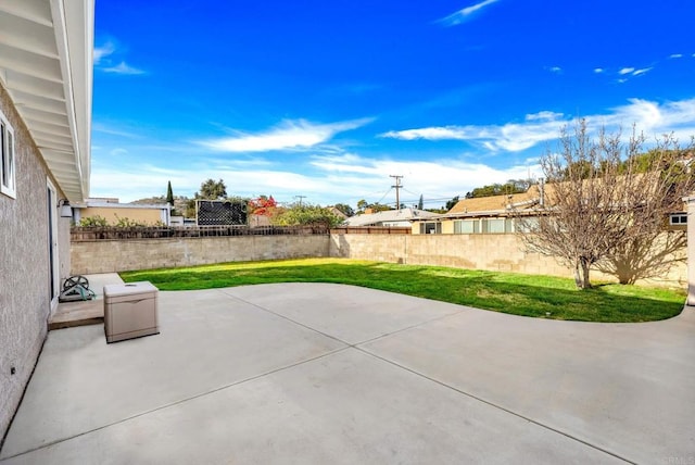 view of patio / terrace featuring fence