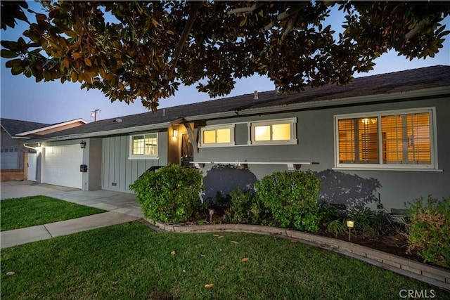 single story home featuring a garage, crawl space, a front lawn, and stucco siding