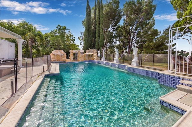 view of swimming pool with fence and a fenced in pool