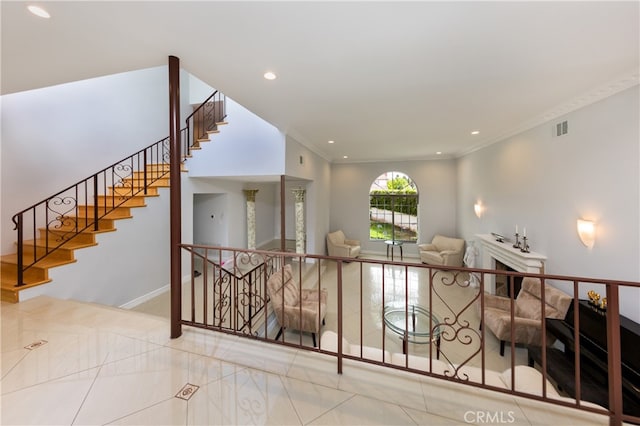 interior space with tile patterned flooring, recessed lighting, visible vents, baseboards, and crown molding