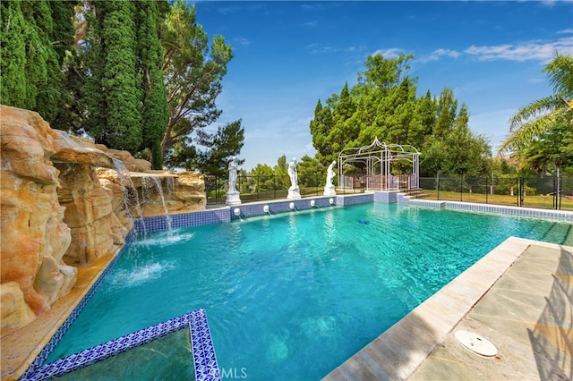 view of swimming pool featuring a fenced in pool and fence