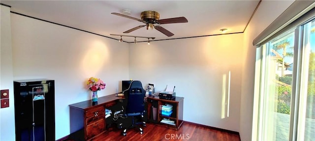 office space with a ceiling fan, rail lighting, baseboards, and wood finished floors