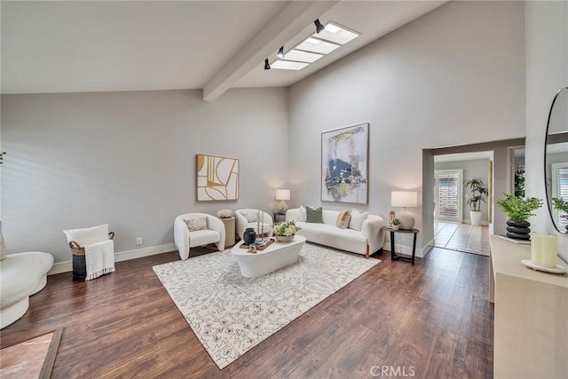 living room with dark wood-style floors, high vaulted ceiling, beamed ceiling, and baseboards