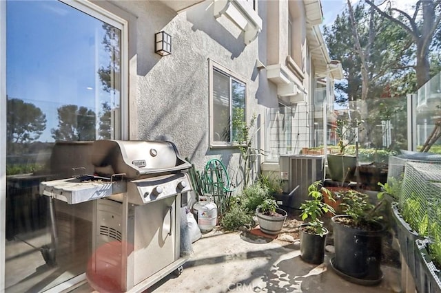 view of patio / terrace with a grill and central AC unit