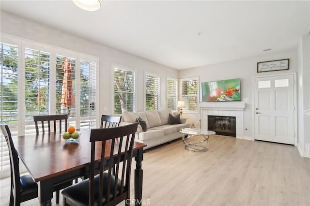 sunroom / solarium with a fireplace