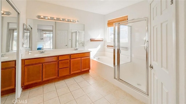 full bathroom with a garden tub, tile patterned flooring, a sink, a shower stall, and double vanity