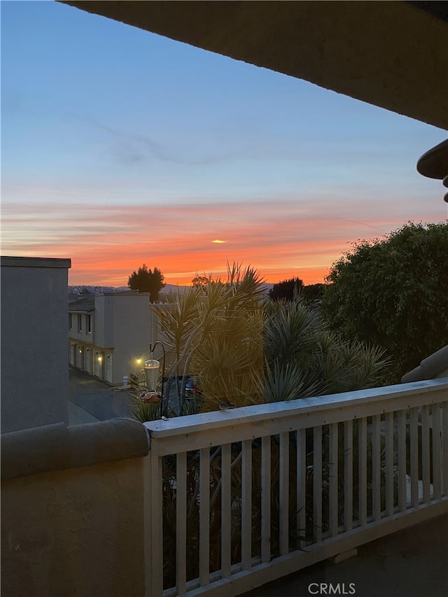 view of balcony at dusk