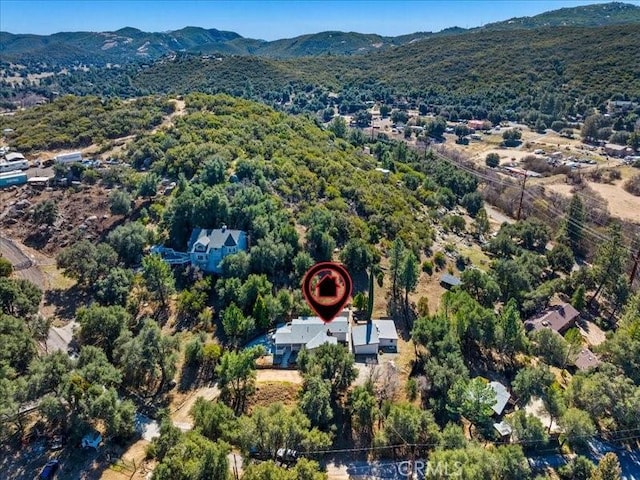 birds eye view of property featuring a mountain view