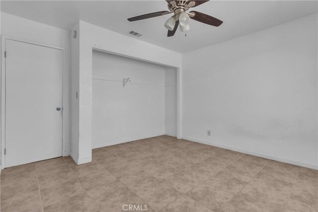 unfurnished bedroom with a ceiling fan, a closet, visible vents, and baseboards