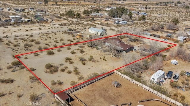 aerial view featuring a desert view and a rural view