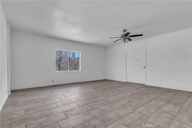 unfurnished room featuring ceiling fan