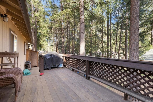 wooden deck with grilling area