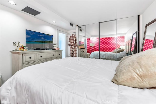 bedroom with visible vents and recessed lighting