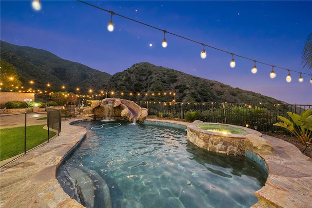 2514 Bulrush Cir, Corona, CA 92882 - view of swimming pool with a mountain view, fence, and a pool with connected hot tub