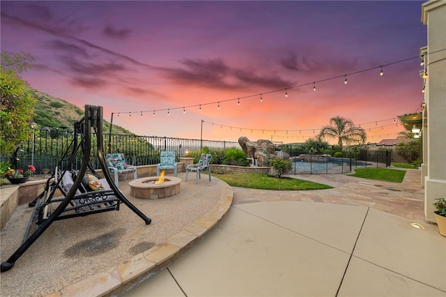 2514 Bulrush Cir, Corona, CA 92882 - view of patio featuring a fire pit and fence