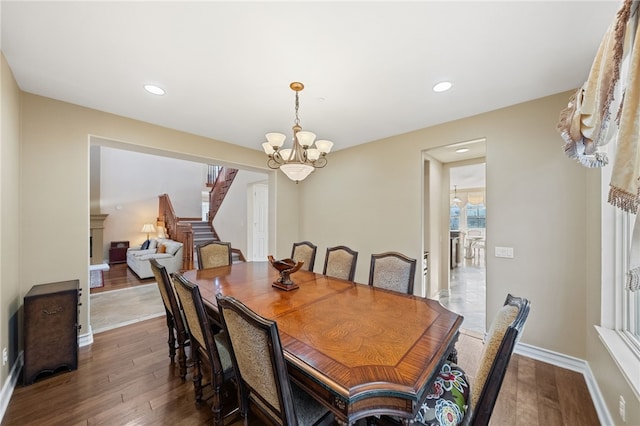 2514 Bulrush Cir, Corona, CA 92882 - dining area with stairway, dark wood-type flooring, a chandelier, baseboards, and recessed lighting