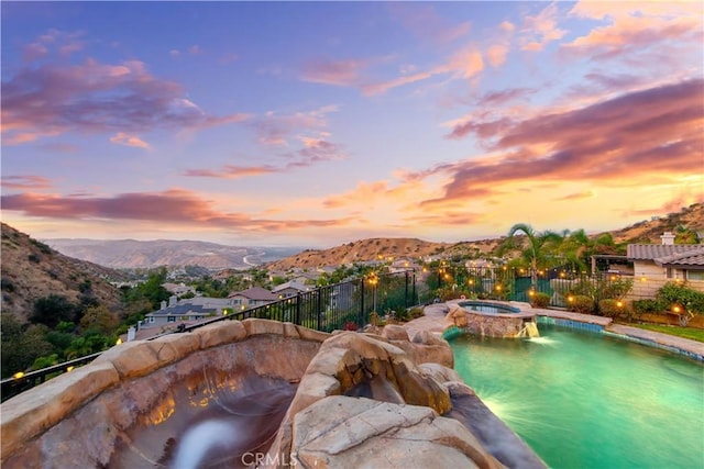 2514 Bulrush Cir, Corona, CA 92882 - view of swimming pool with a mountain view, fence, and a pool with connected hot tub