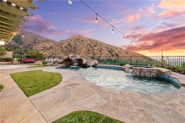 2514 Bulrush Cir, Corona, CA 92882 - view of swimming pool featuring fence, a mountain view, a pool with connected hot tub, and a patio