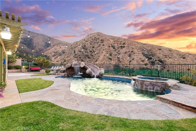 2514 Bulrush Cir, Corona, CA 92882 - view of pool featuring a mountain view, fence, a patio area, and a pool with connected hot tub