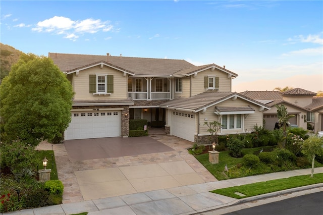 2514 Bulrush Cir, Corona, CA 92882 - view of front of home featuring a garage, concrete driveway, a balcony, and a tile roof