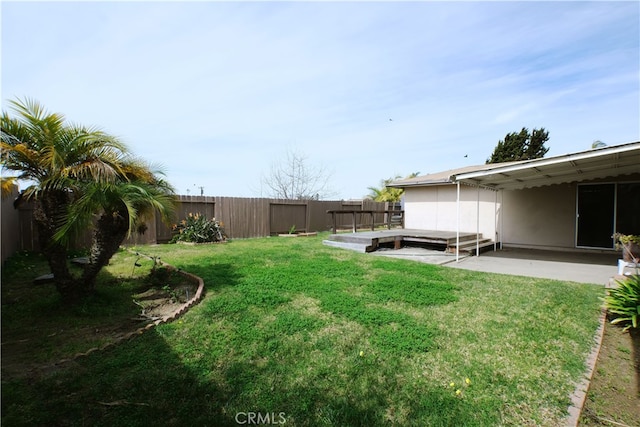 view of yard featuring a patio area and a fenced backyard