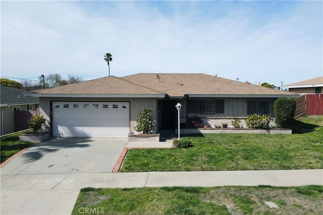 single story home with concrete driveway, an attached garage, fence, a front lawn, and stucco siding